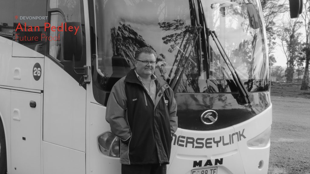 Alan Pedley of Merseylink stands in front of one of his buses