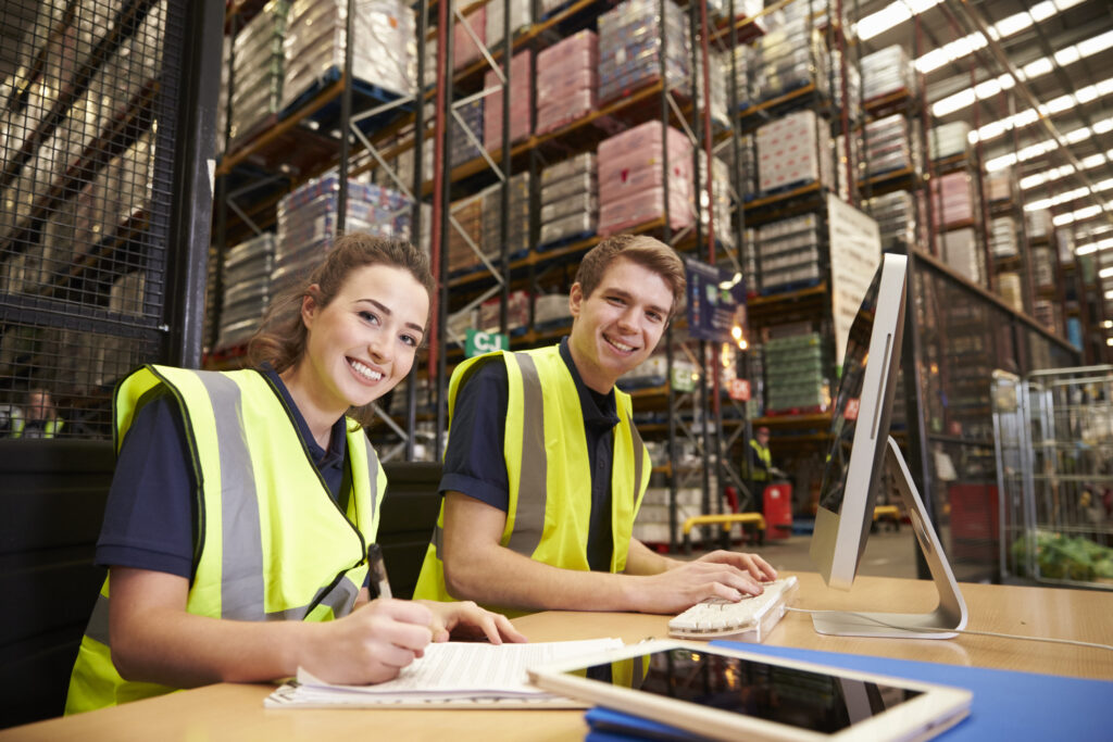 Short-term placement staff in the office of a distribution warehouse, to camera