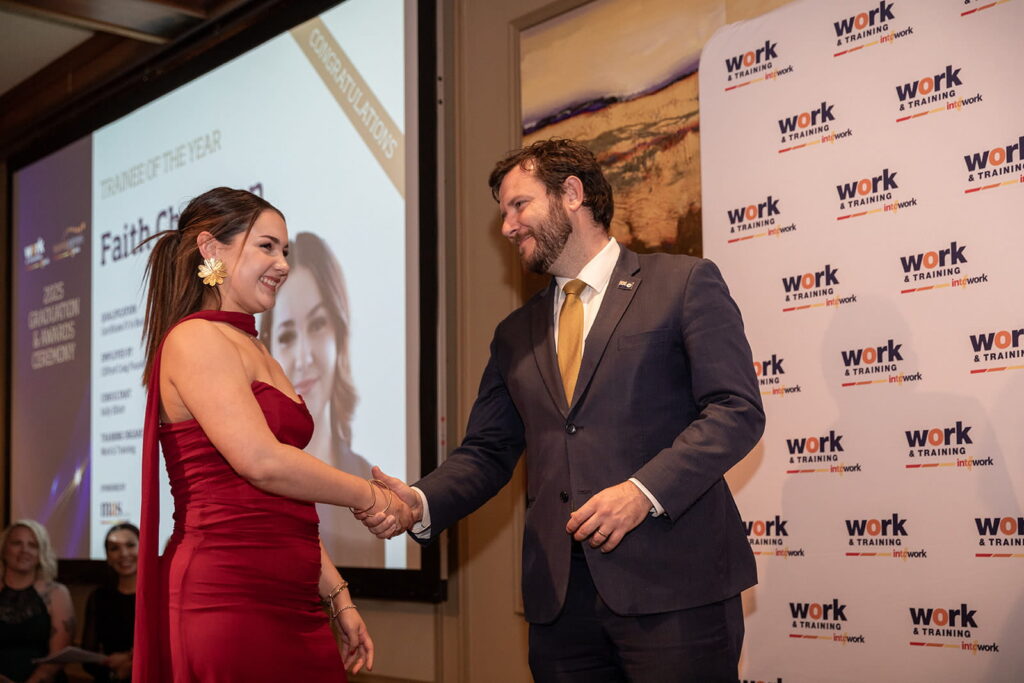 Faith accepting award on stage