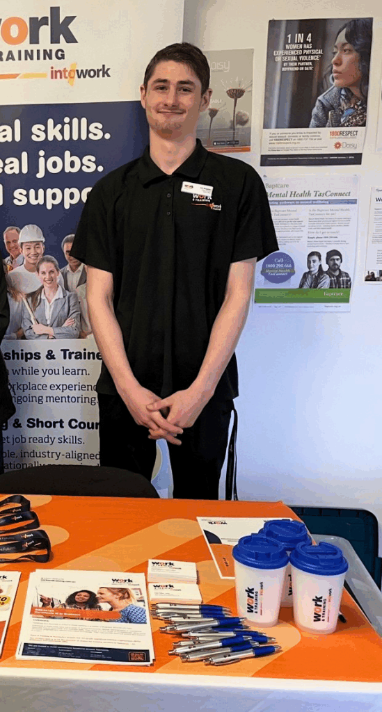 Indi standing behind expo table