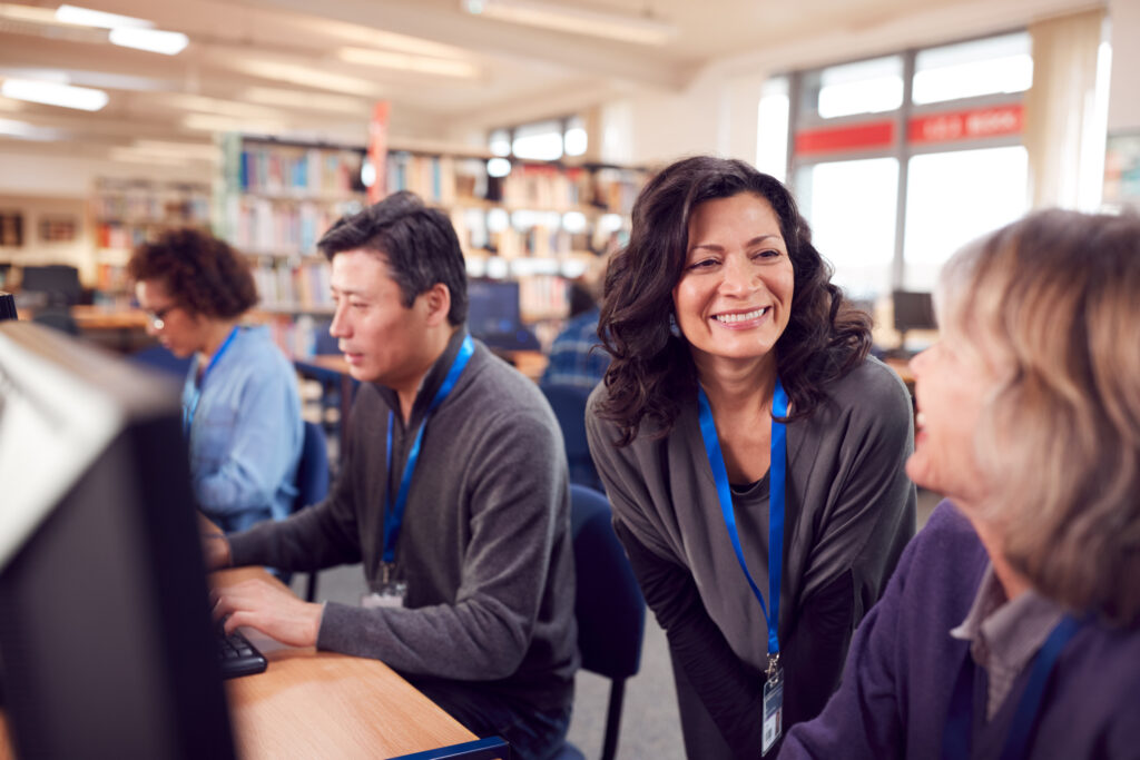 Teacher helping students